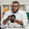 186549270-young-african-american-photographer-works-in-home-office-remote-job-concept